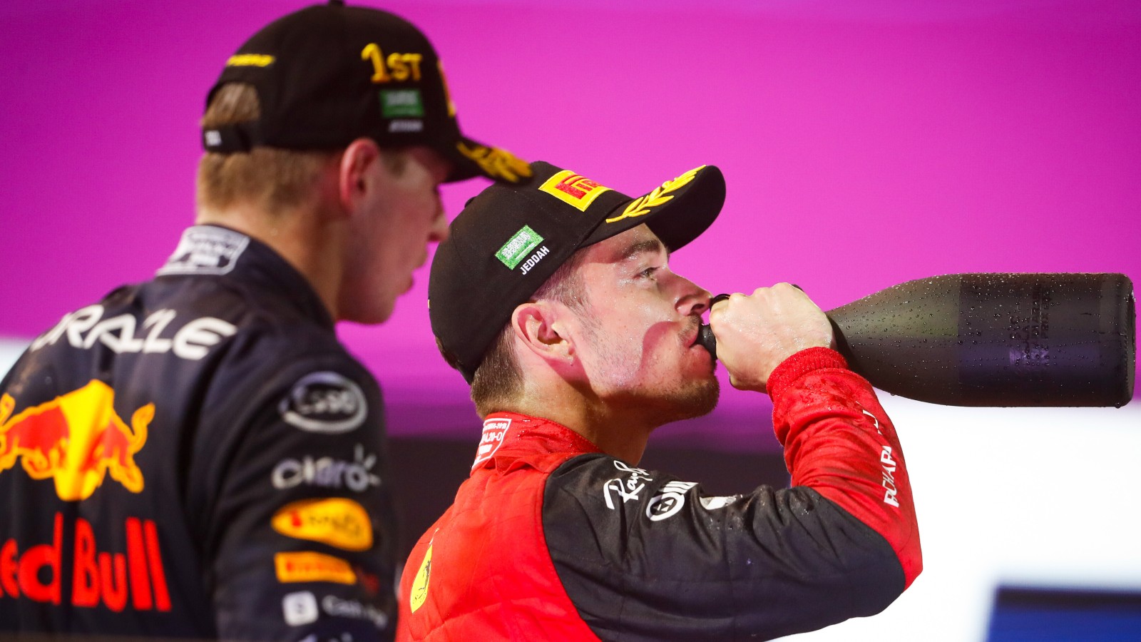 Charles Leclerc, Ferrari, drinks from the bottle on the podium. Saudi Arabia, March 2022.