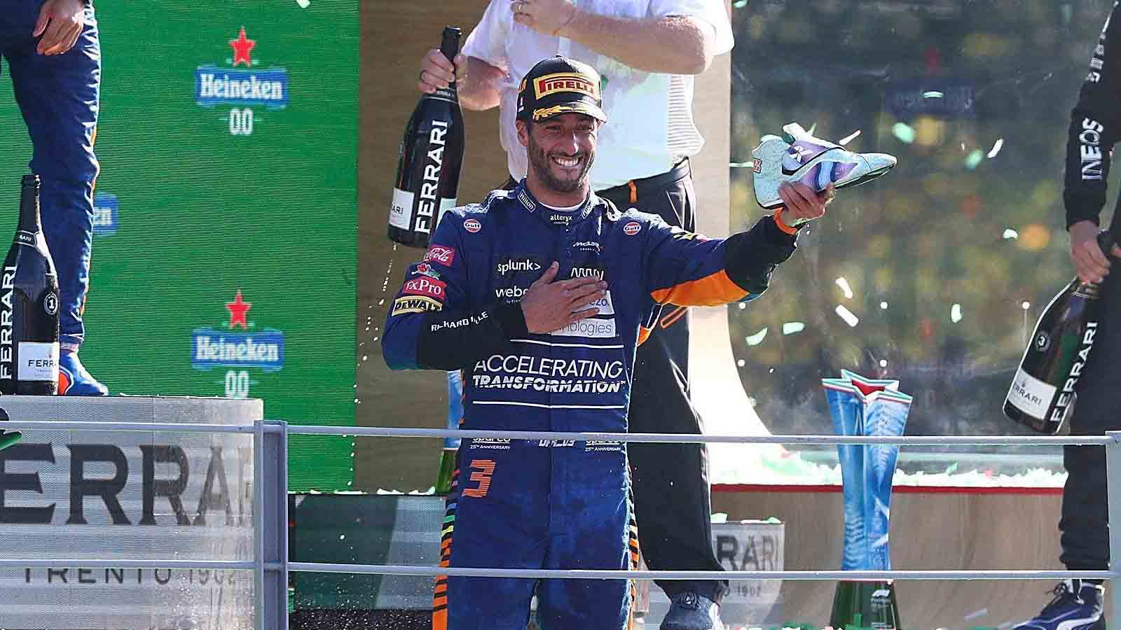 Daniel Ricciardo lines up a shoey. Monza September 2021.