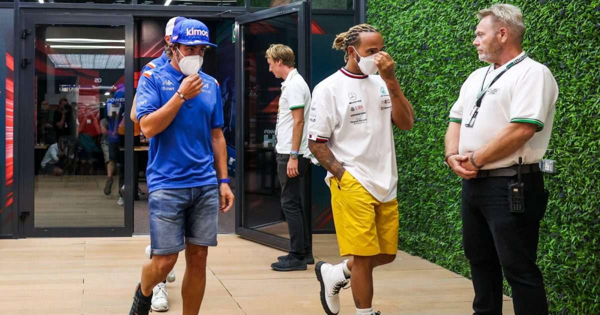 Fernando Alonso and Lewis Hamilton walk together. Saudi Arabia, March 2022.