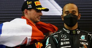 Max Verstappen and Lewis Hamilton share the podium. Abu Dhabi, December 2021.
