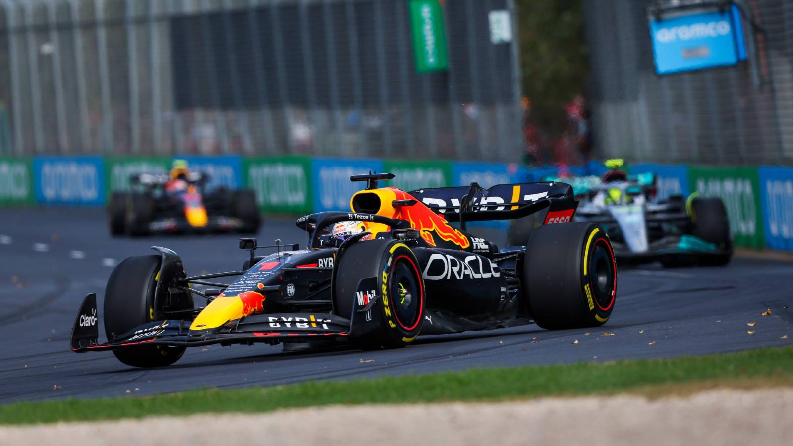 Max Verstappen ahead of a Mercedes and Sergio Perez's Red Bull. Melbourne April 2022.