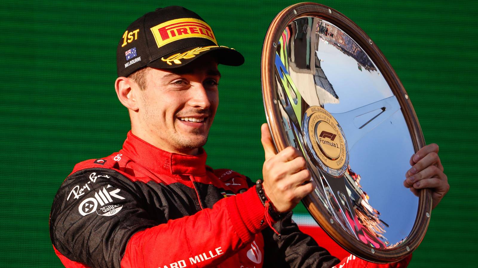 Ferrari's Charles Leclerc holds the P1 trophy. Australia, April 2022.