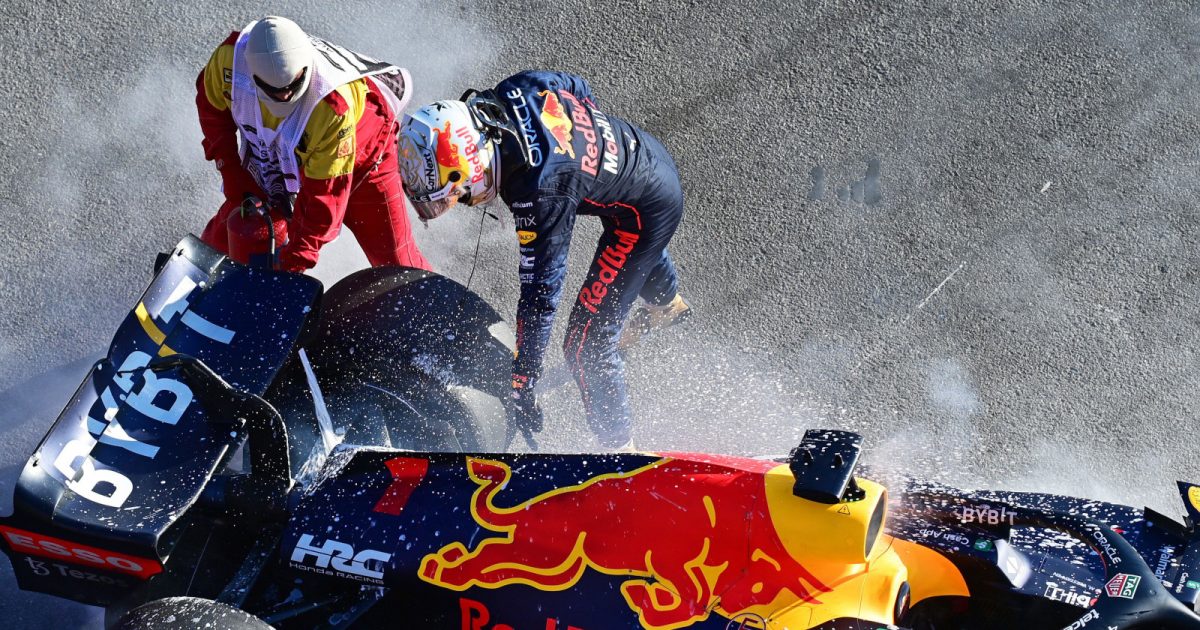 Red Bull driver Max Verstappen points where he wants a marshal to spray fire retardant. Australia April 2022