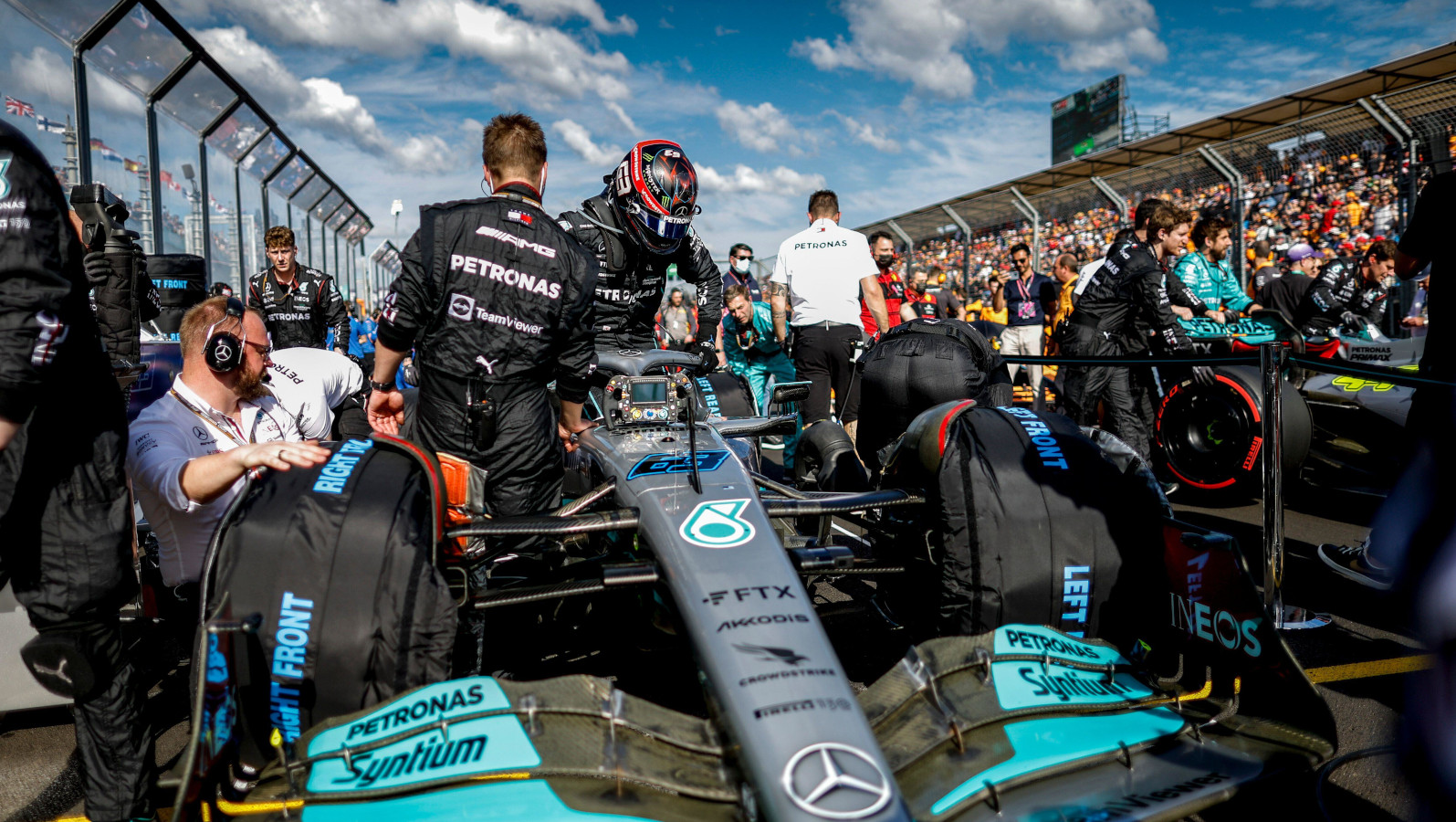 George Russell climbs into his car on the grid. Australia April 2022