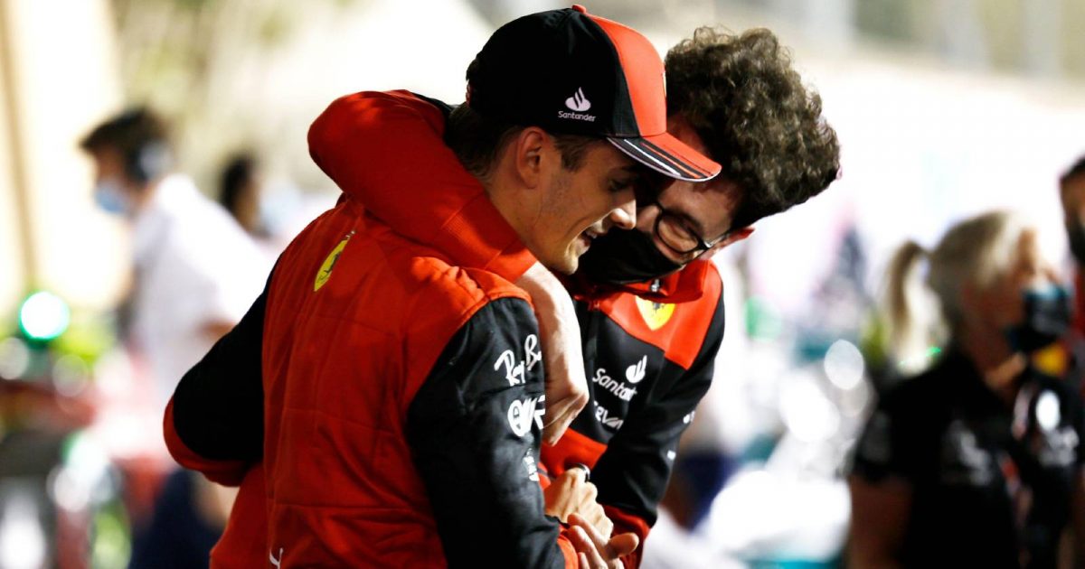 Mattia Binotto grabs Charles Leclerc. Bahrain March 2022.