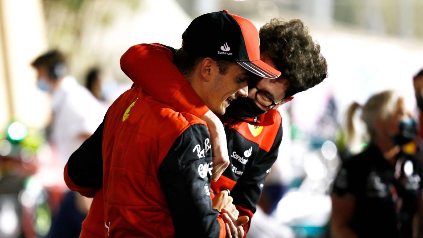 Mattia Binotto grabs Charles Leclerc. Bahrain March 2022.