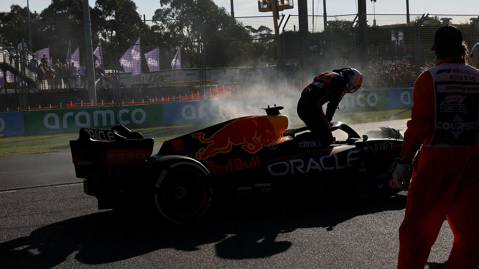 Max Verstappen climbs out of his smoking Red Bull. Australia April 2022