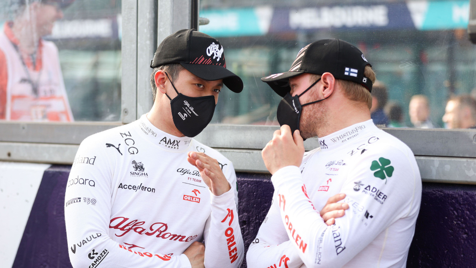 Alfa Romeo driver Guanyu Zhou explains to Valtteri Bottas. Australia April 2022