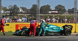 Sebastian Vettel helps to push his Aston Martin. Melbourne April 2022.