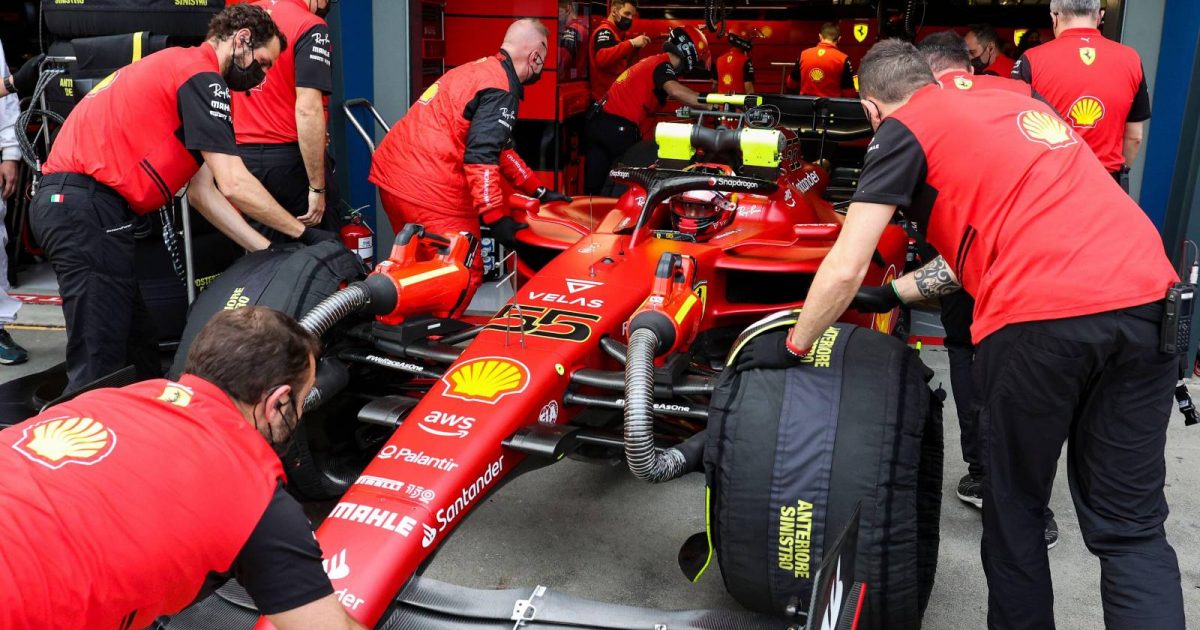 Ferrari wheel Carlos Sainz into the garage. Australia, April 2022.