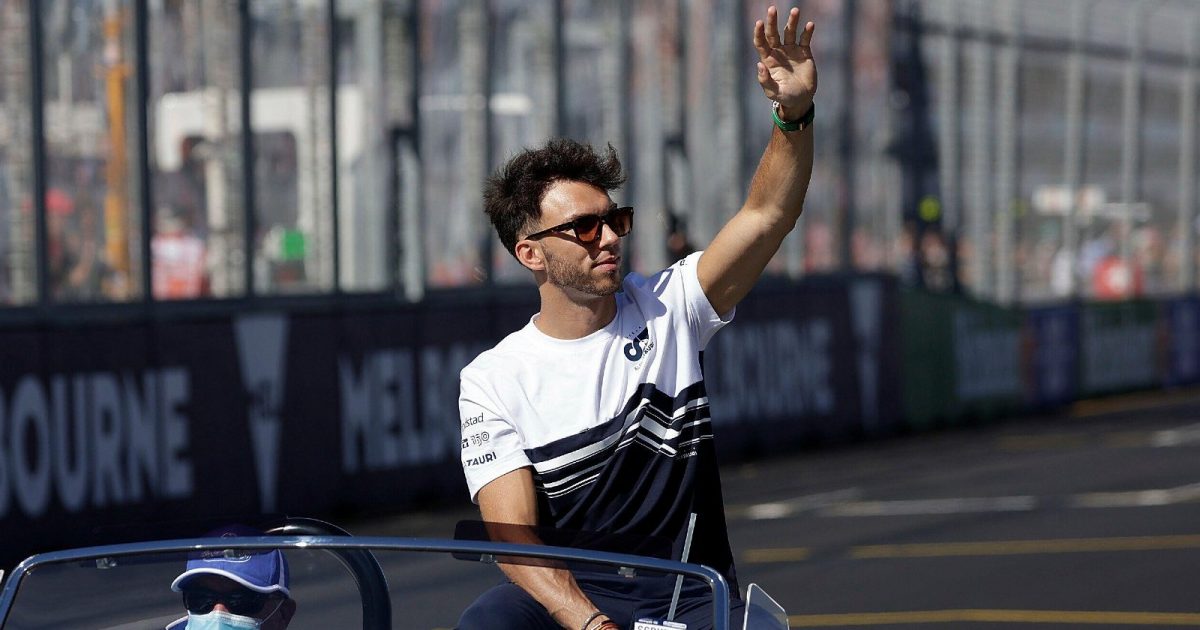 Pierre Gasly waving whilst sat in a car. Melbourne, April 2022.