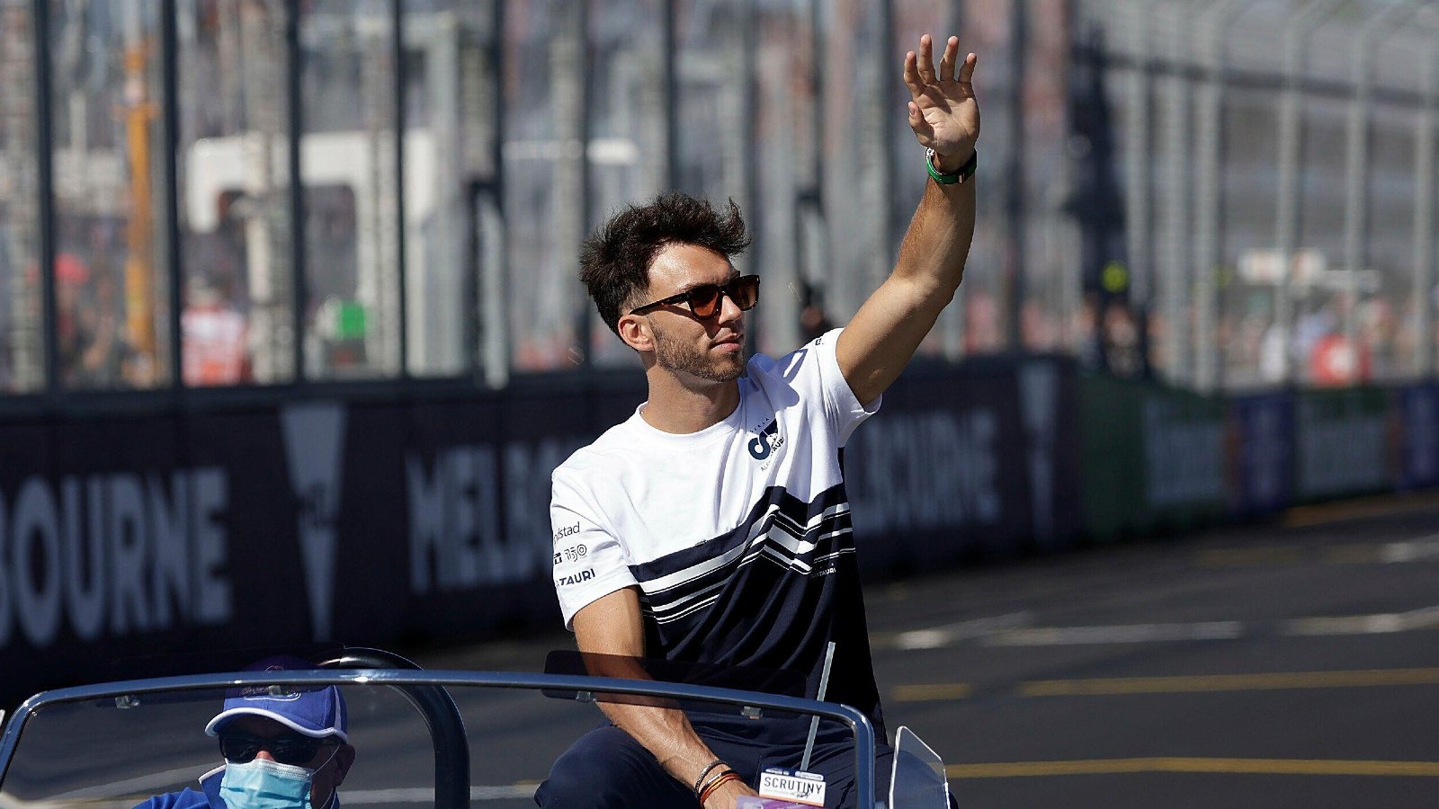 Pierre Gasly waving whilst sat in a car. Melbourne, April 2022.