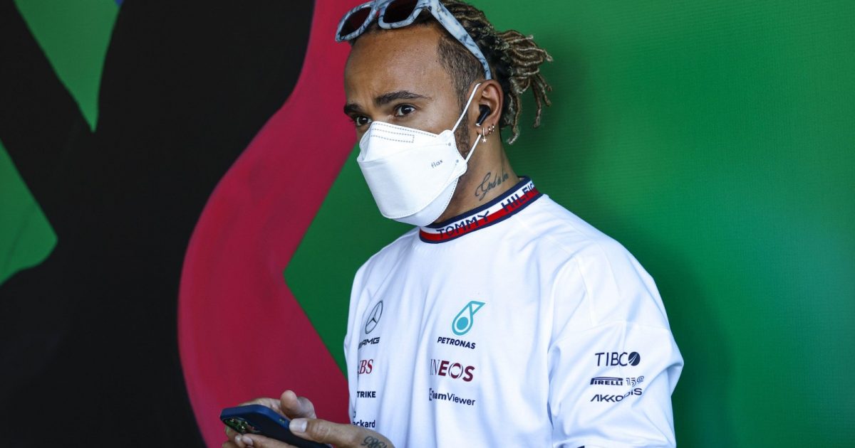 Lewis Hamilton on his phone. Melbourne, April 2022.