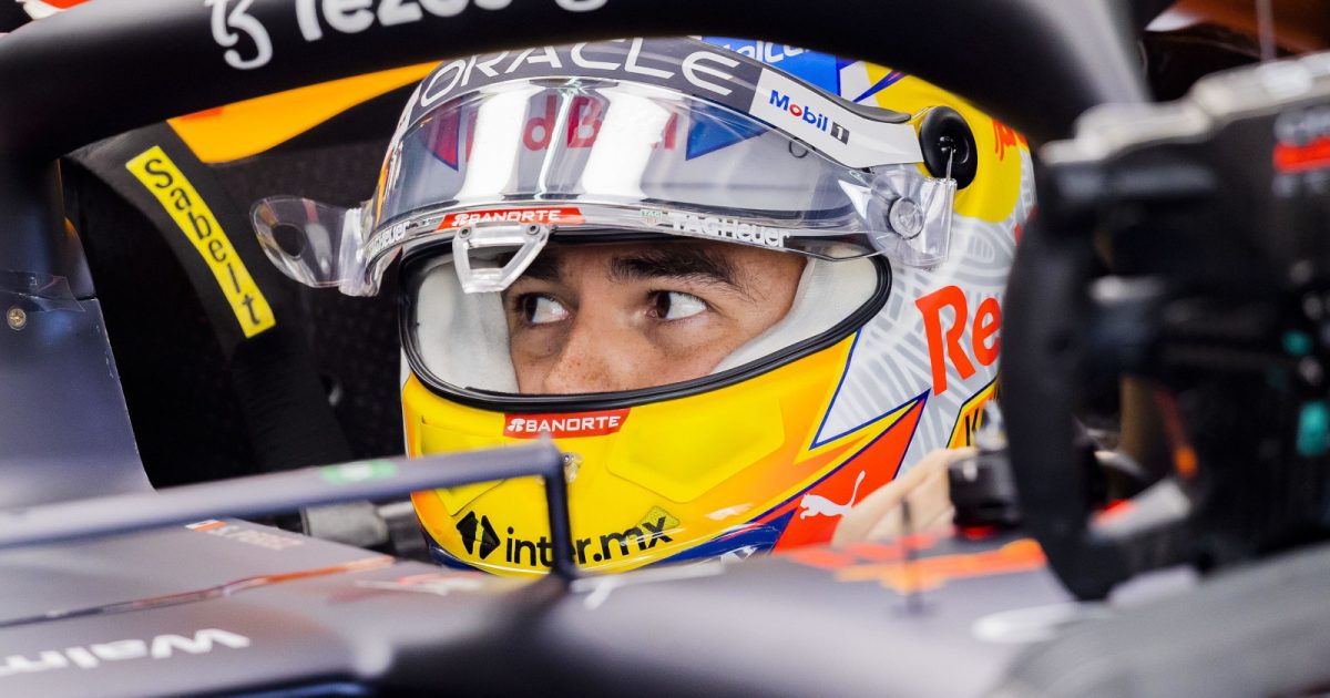 Sergio Perez sitting in his RB18 looking to the side. Imola April 2022
