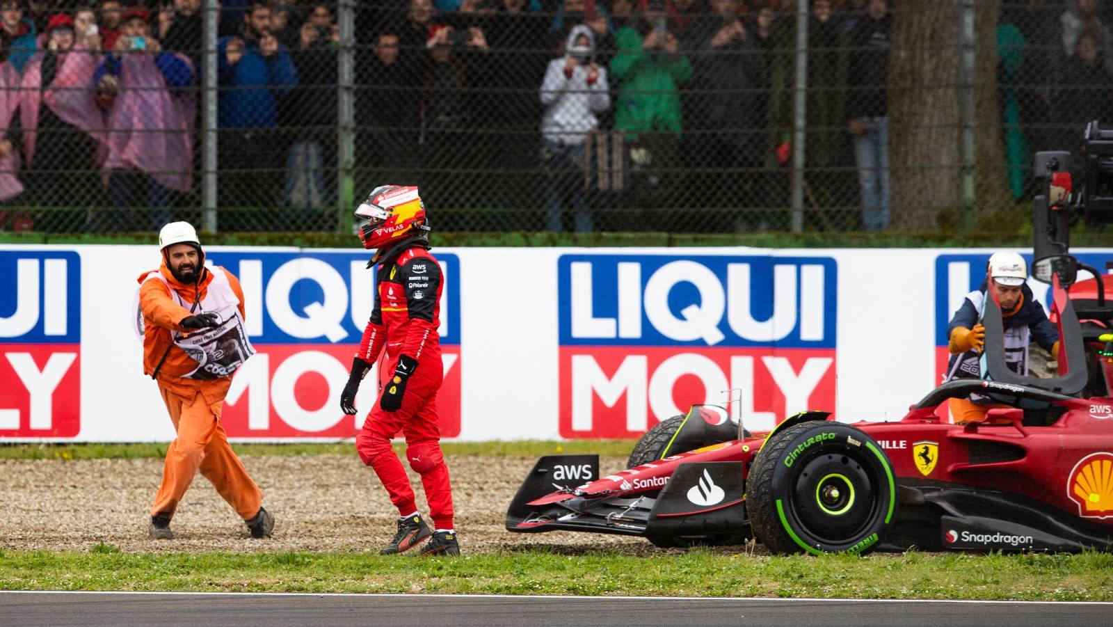 Carlos Sainz walks away from his beached Ferrari. Imola April 2022.