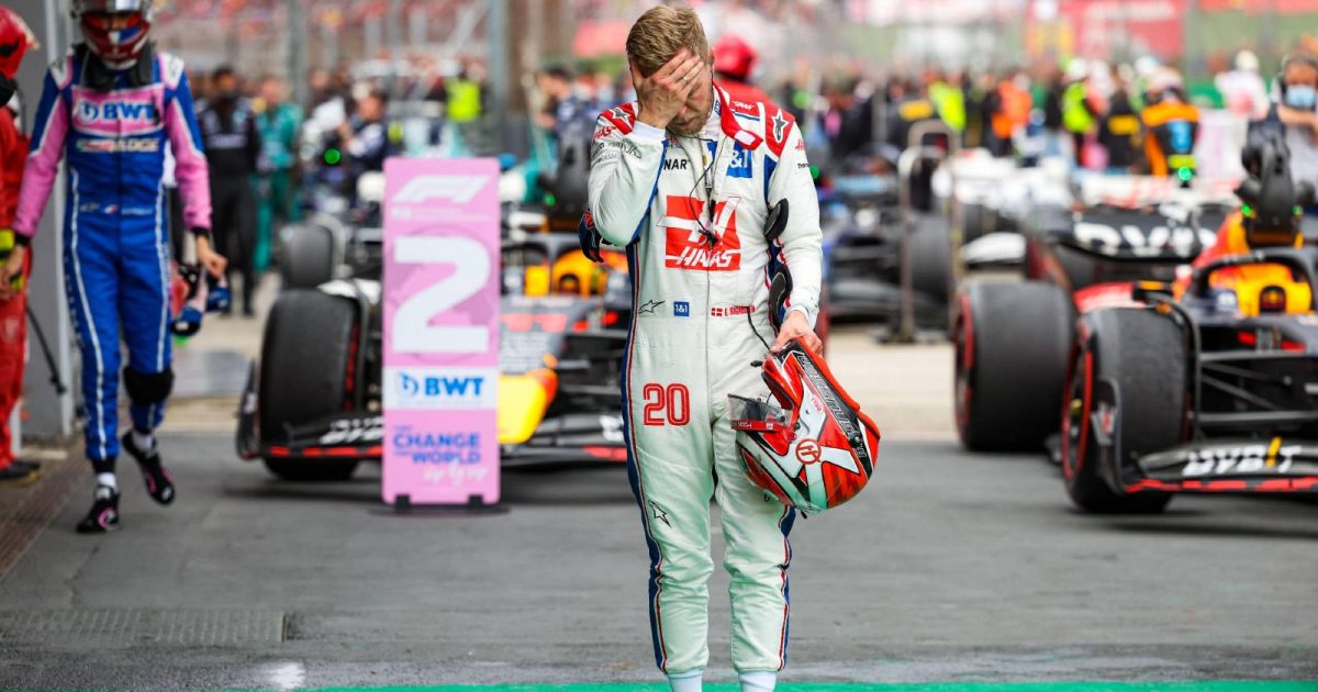 Kevin Magnussen walks with his hand over his face. Imola April 2022.