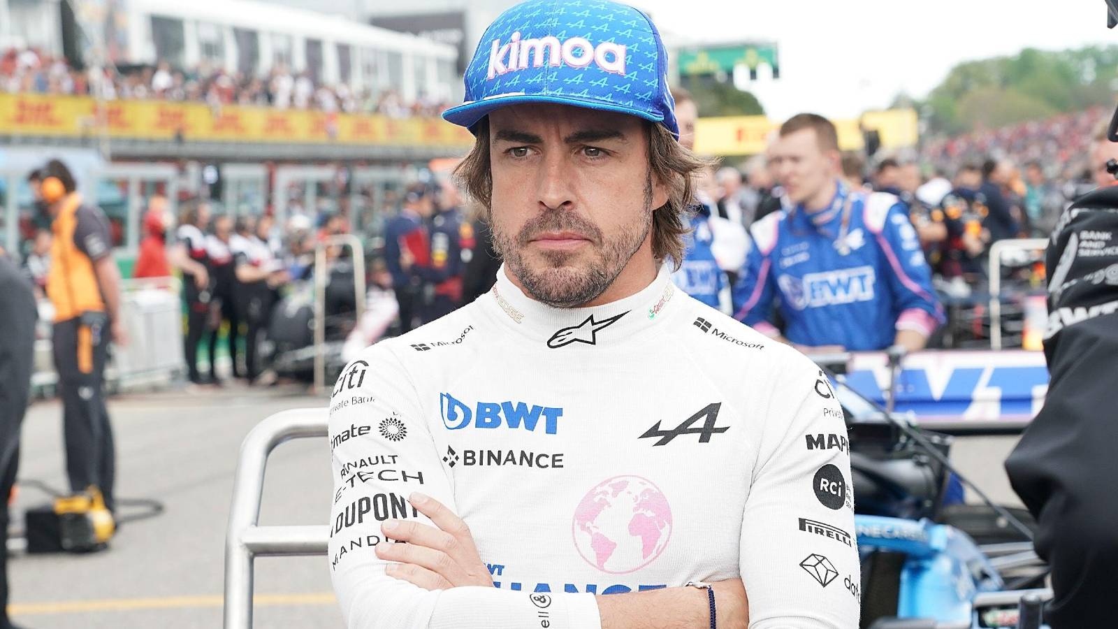 Fernando Alonso stands arms folded at Imola. Italy, April 2022.