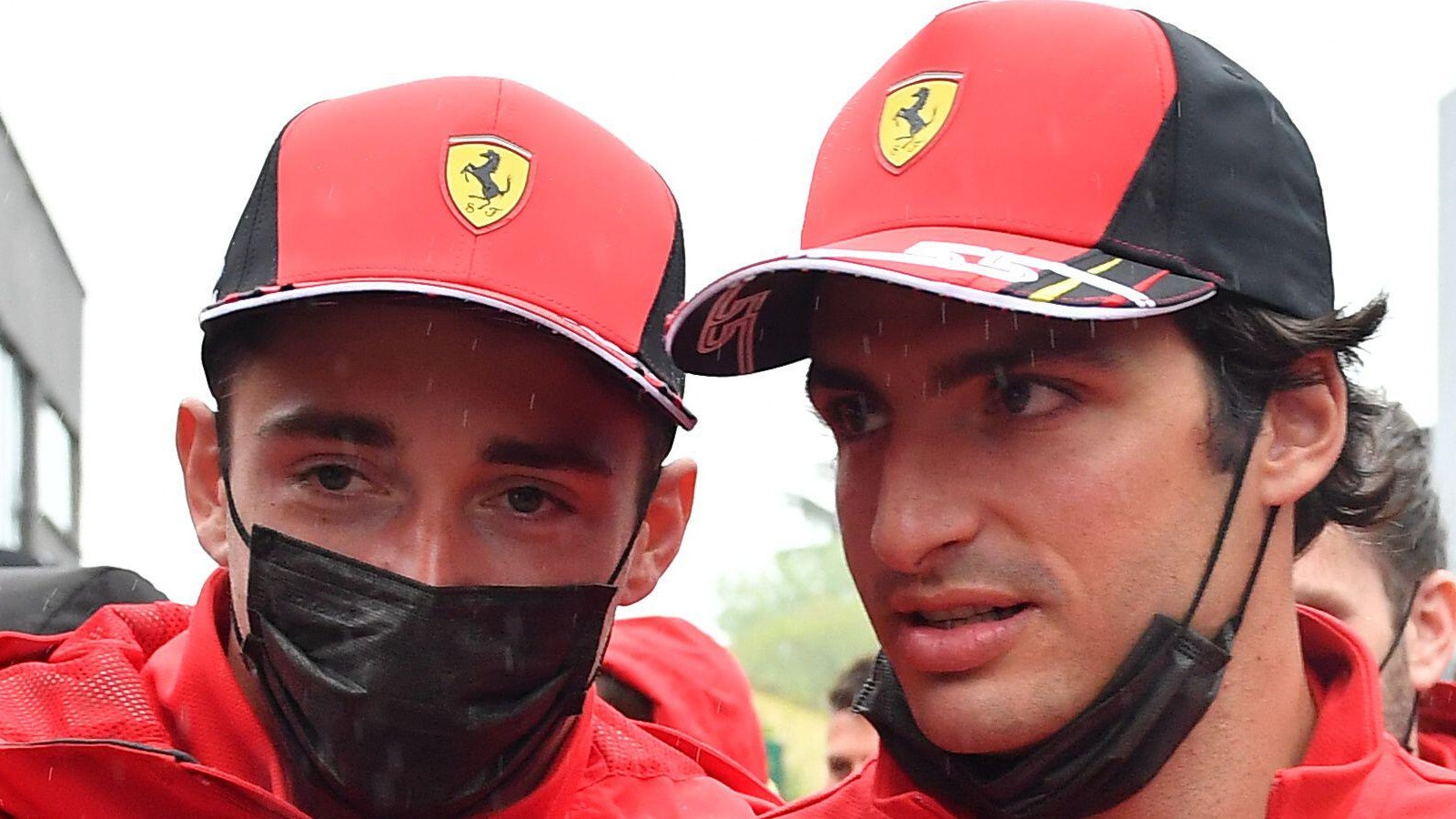Charles Leclerc and Carlos Sainz, Ferrari, stand together. Italy, April 2022.
