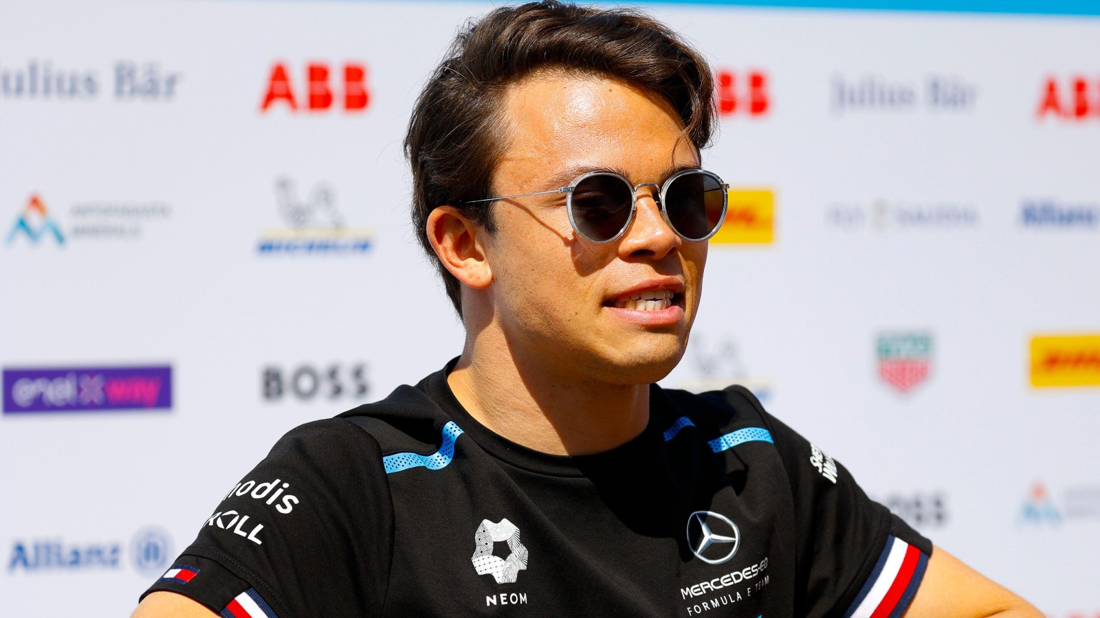 Nyck de Vries wears sunglasses and a Mercedes shirt. Monaco, April 2022.