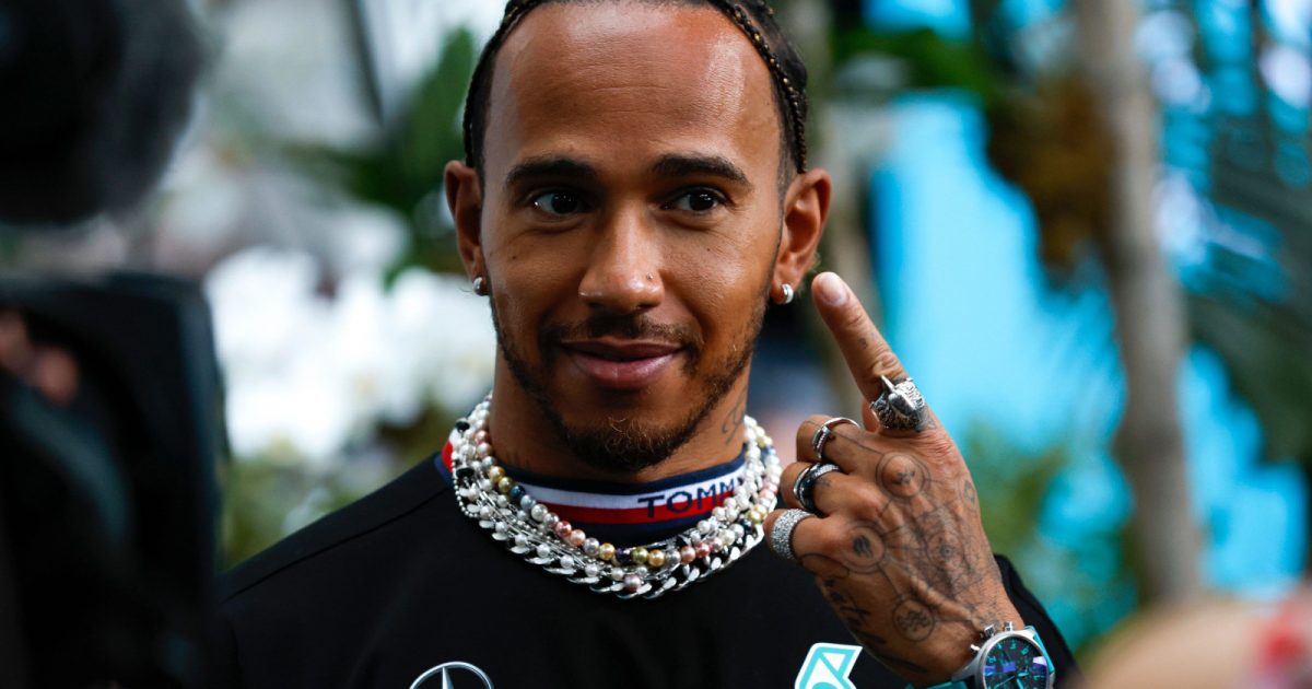 Lewis Hamilton points to his earrings. Miami May 2022