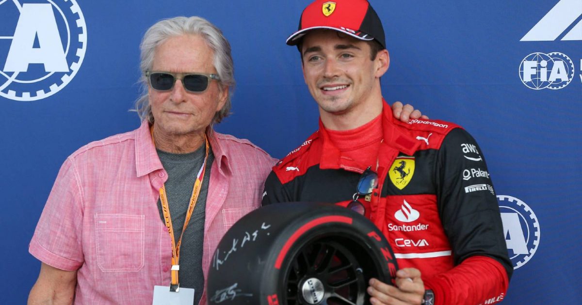 Charles Leclerc standing with Michael Douglas. Miami May 2022.