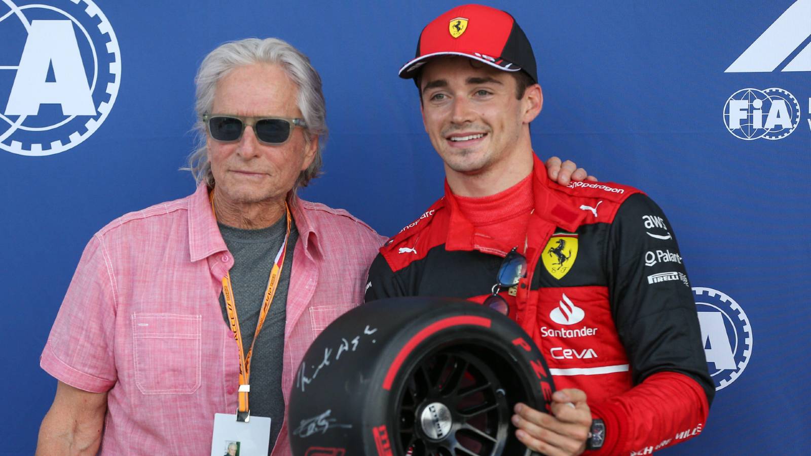 Charles Leclerc standing with Michael Douglas aft. Miami May 2022.