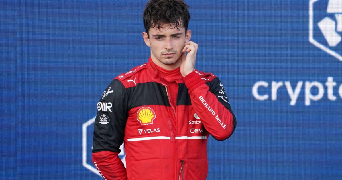 Charles Leclerc, Ferrari, looks disappointed on the podium. United States, May 2022.