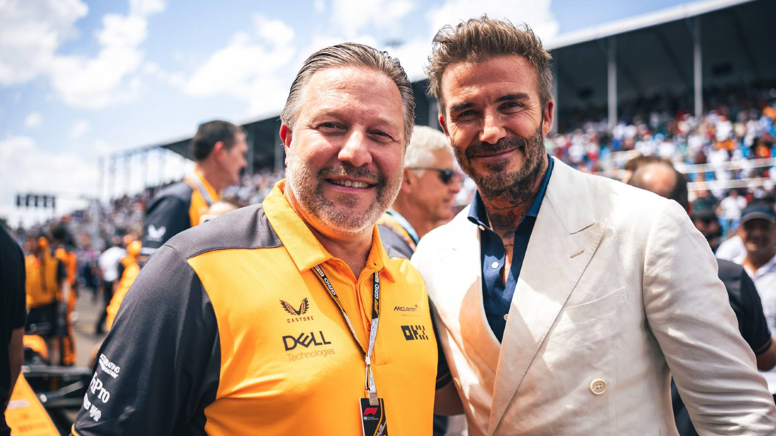 Zak Brown poses for a photo with David Beckham. Miami May 2022.