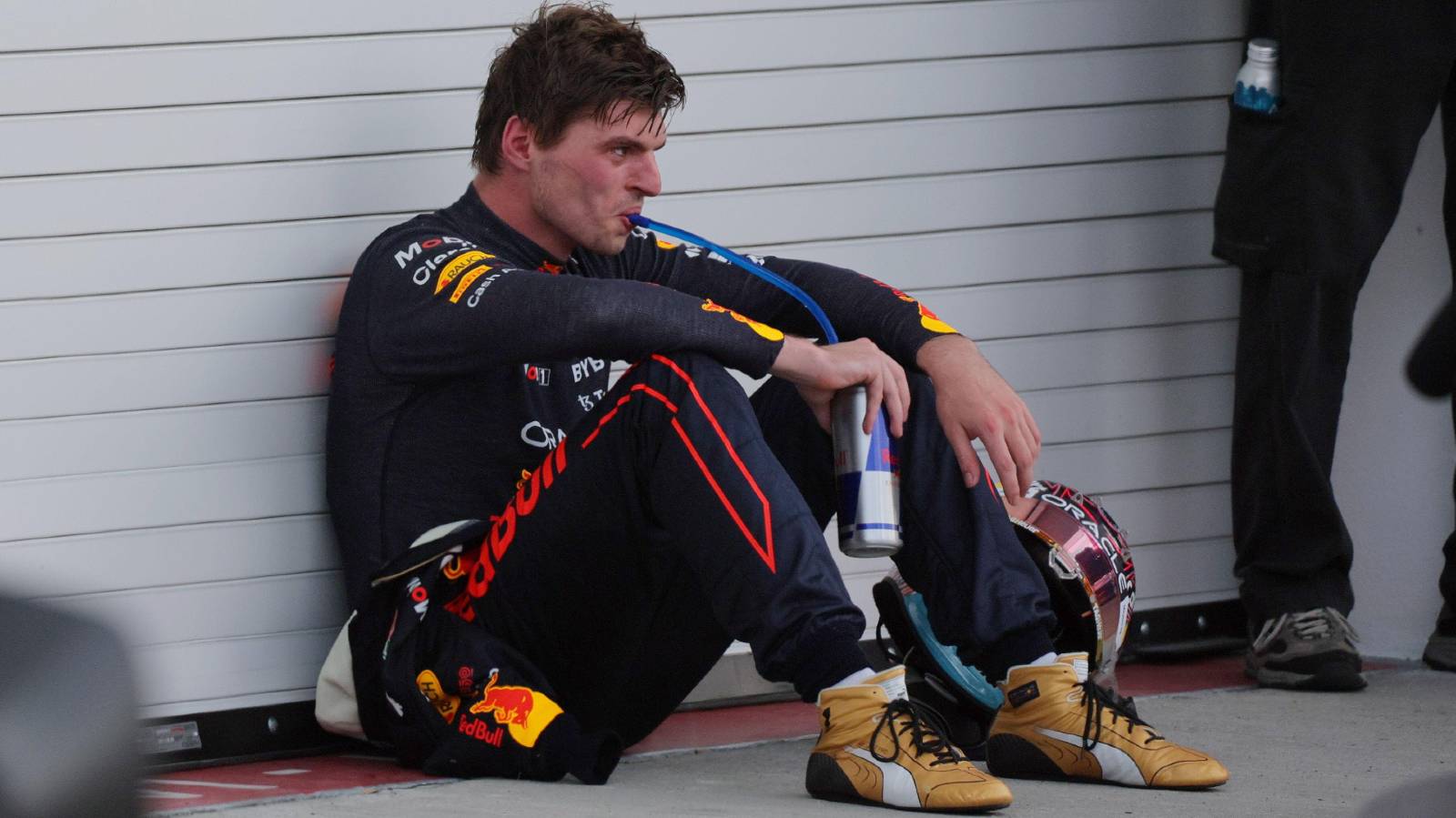 Max Verstappen sitting on the floor. Miami May 2022.