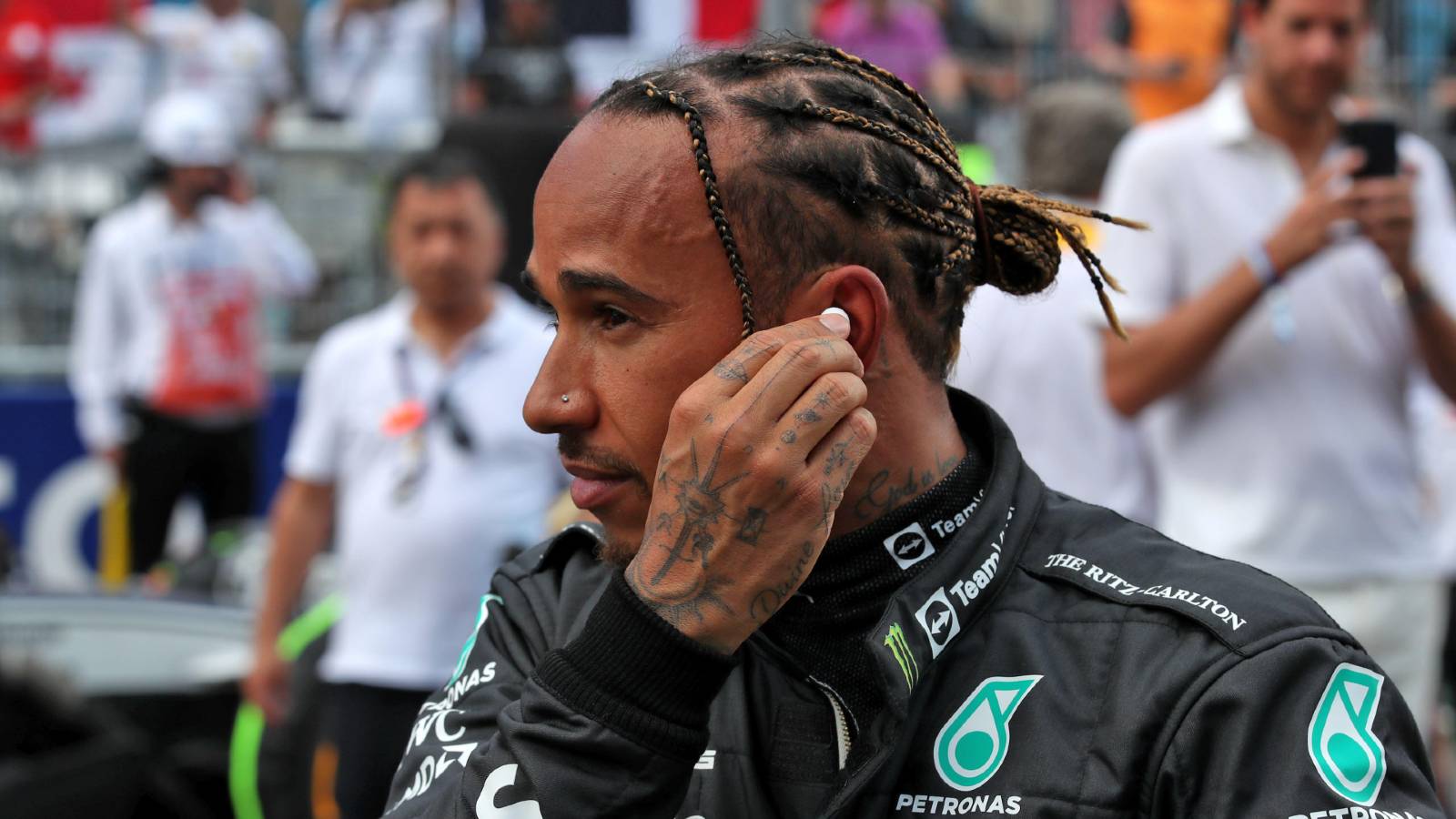 Lewis Hamilton fitting his earplugs. Miami May 2022.