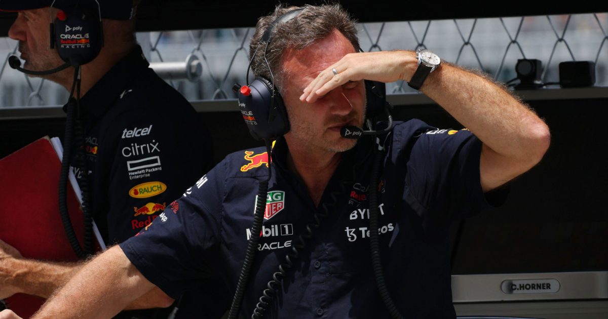 Christian Horner looks down the pit lane, Adrian Newey in the background. Miami May 2022