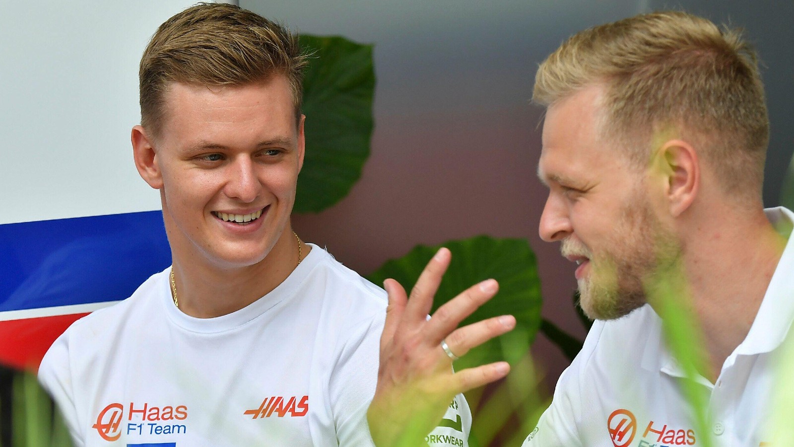 Kevin Magnussen and Mick Schumacher, Haas, talk in Miami. United States, May 2022.