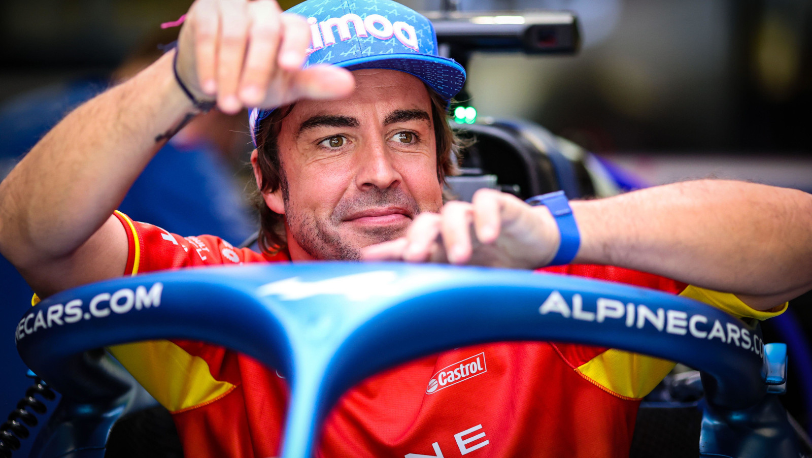 Fernando Alonso smiling as he checks out his Alpine ahead of the race weekend . Spain May 2022