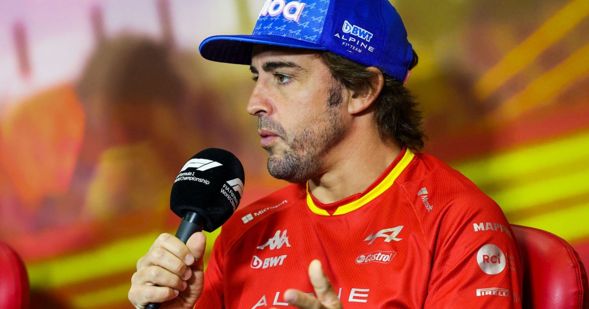 Fernando Alonso holding the microphone in a press conference. Spain May 2022