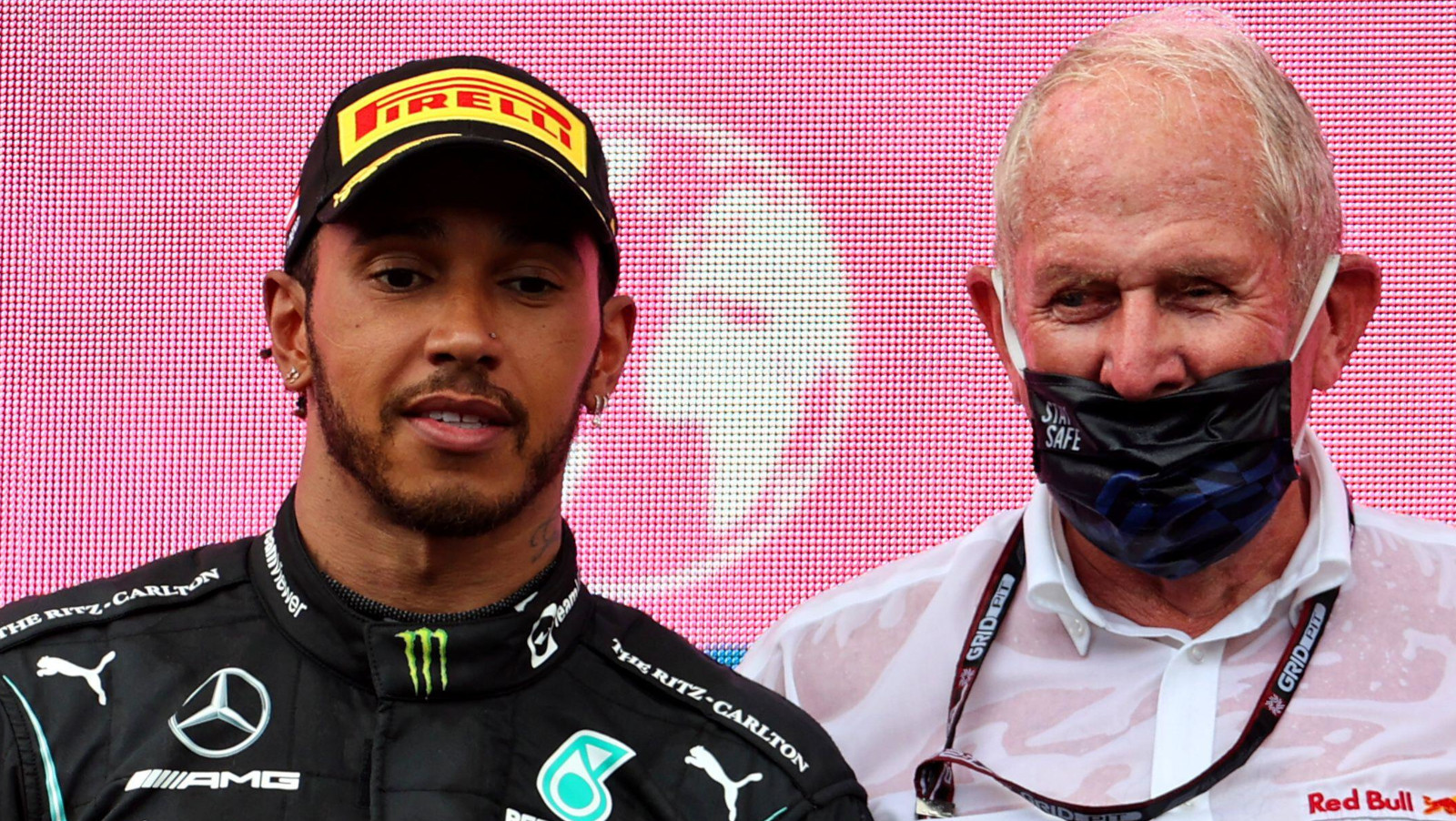 Mercedes driver Lewis Hamilton and Helmut Marko on the podium. Austria June 2021