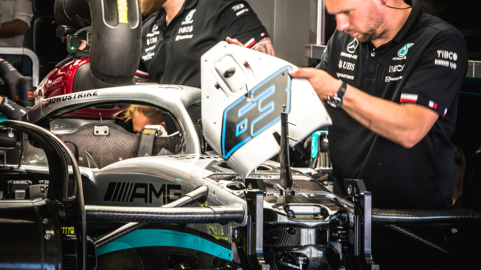 Mercedes mechanics working on George Russell's W13. Spain May 2022
