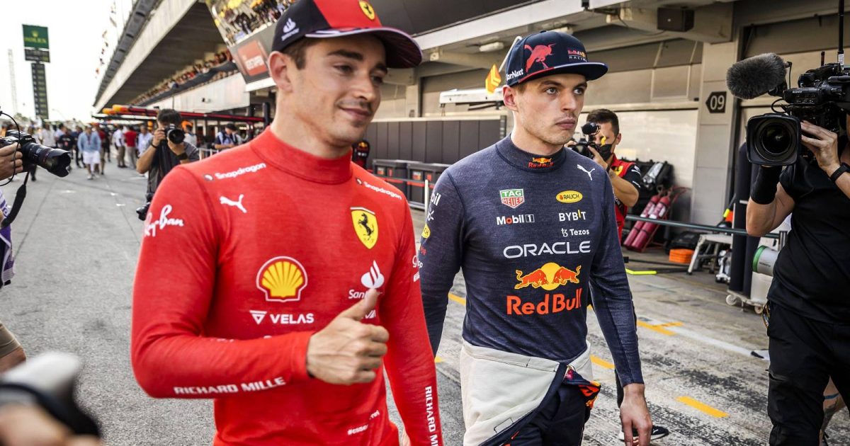 Charles Leclerc, Ferrari, and Max Verstappen, Red Bull, walk. Spain, May 2022.