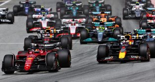 Ferrari's Charles Leclerc leads Red Bull's Max Verstappen into Turn 1 at the 2022 Spanish Grand Prix. Barcelona, May 2022. Results