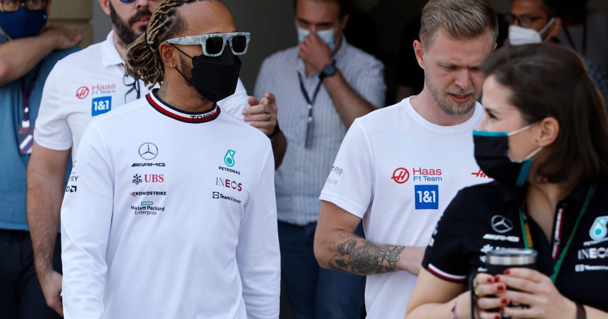 Lewis Hamilton, Mercedes, and Kevin Magnussen, Haas, walk together. Bahrain, March 2022.