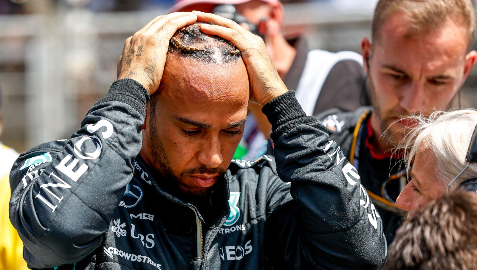 Lewis Hamilton on the grid with his head in his hands. Spain May 2022
