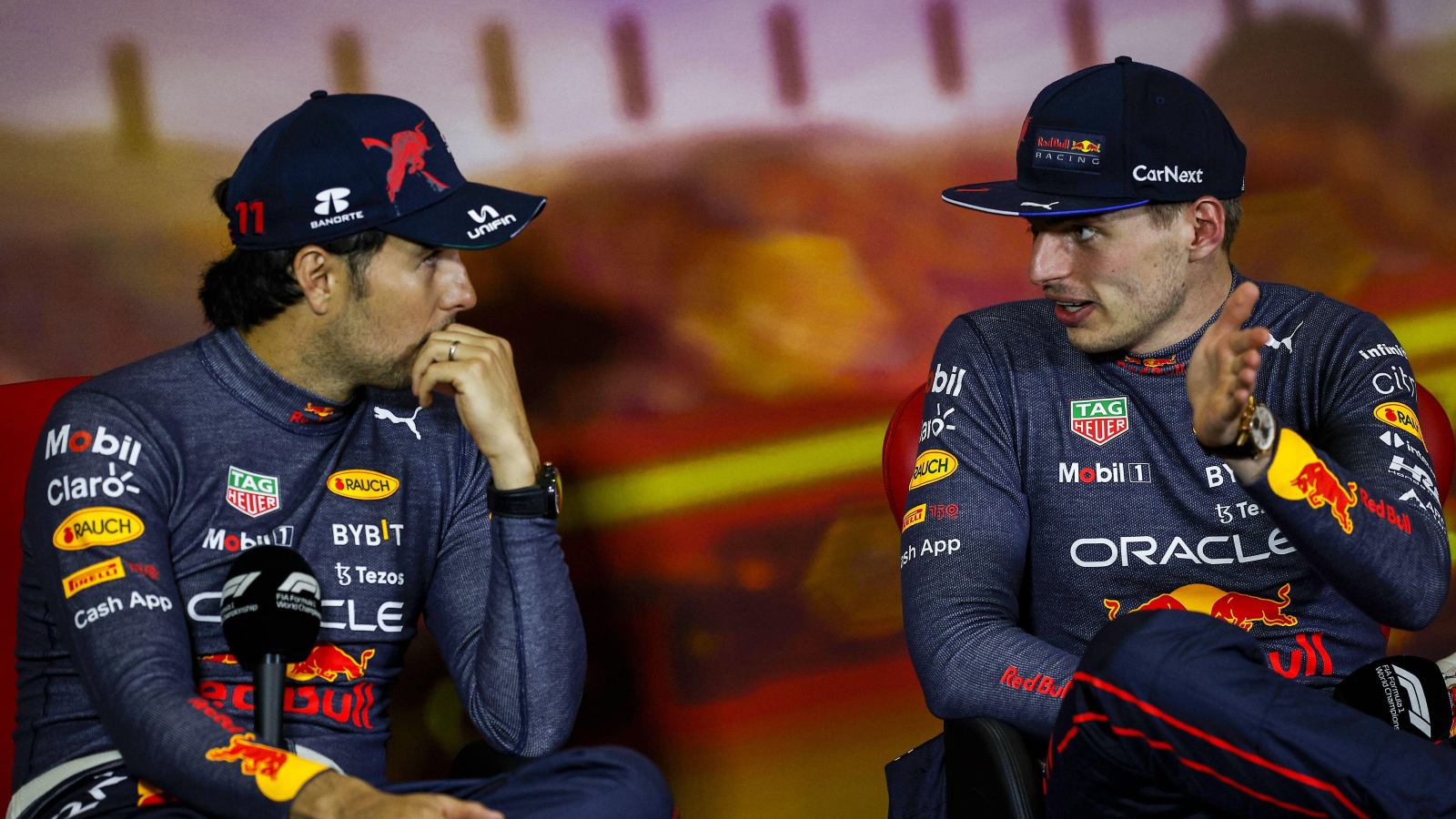 Max Verstappen speaking to Sergio Perez. Barcelona, May 2022.