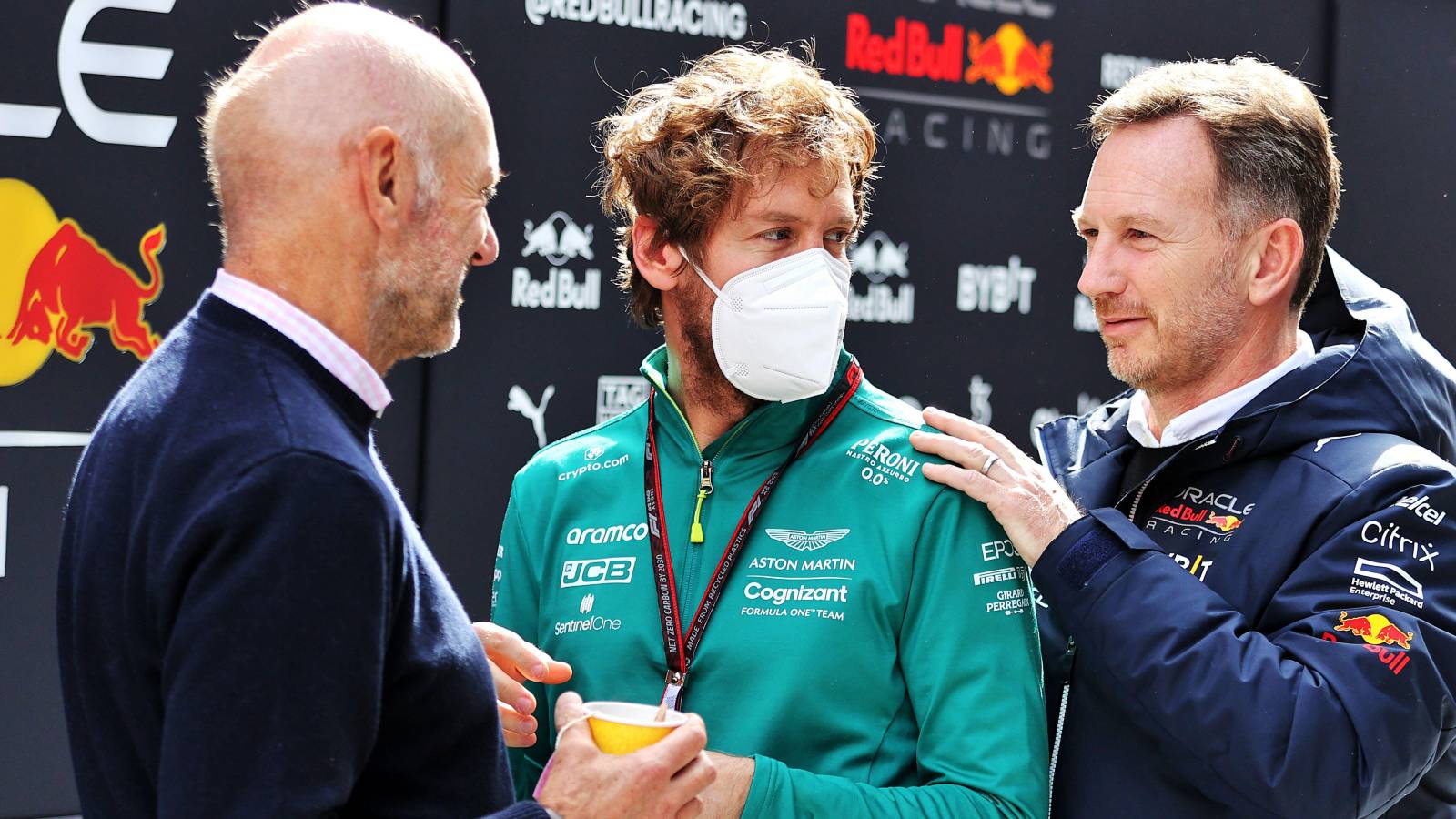 Sebastian Vettel talks to Adrian Newey and Christian Horner of Red Bull. Spain, February 2022.