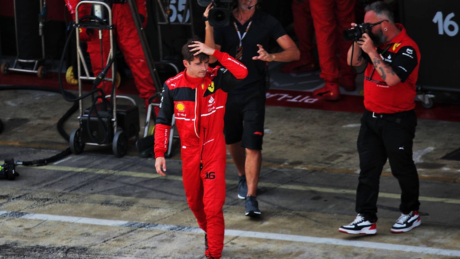 Charles Leclerc walks out of the Ferrari garage after retiring from the Spanish GP. Barcelona May 2022.