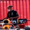 Lewis Hamilton squeezes past Sergio Perez's Red Bull. Barcelona May 2022.