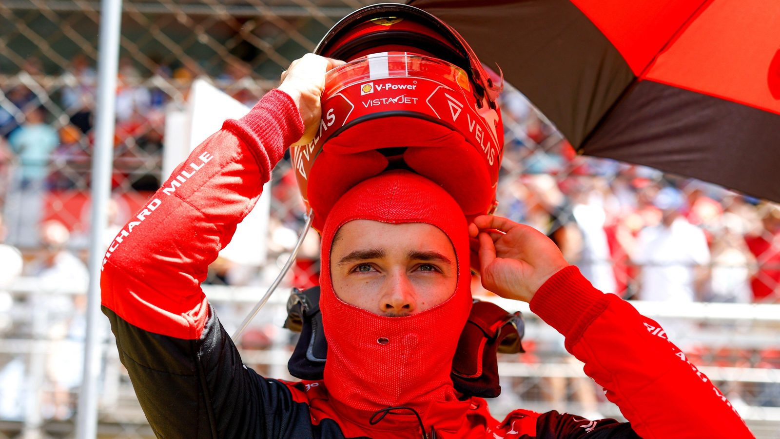 Charles Leclerc putting his helmet on. Barcelona, May 2022.