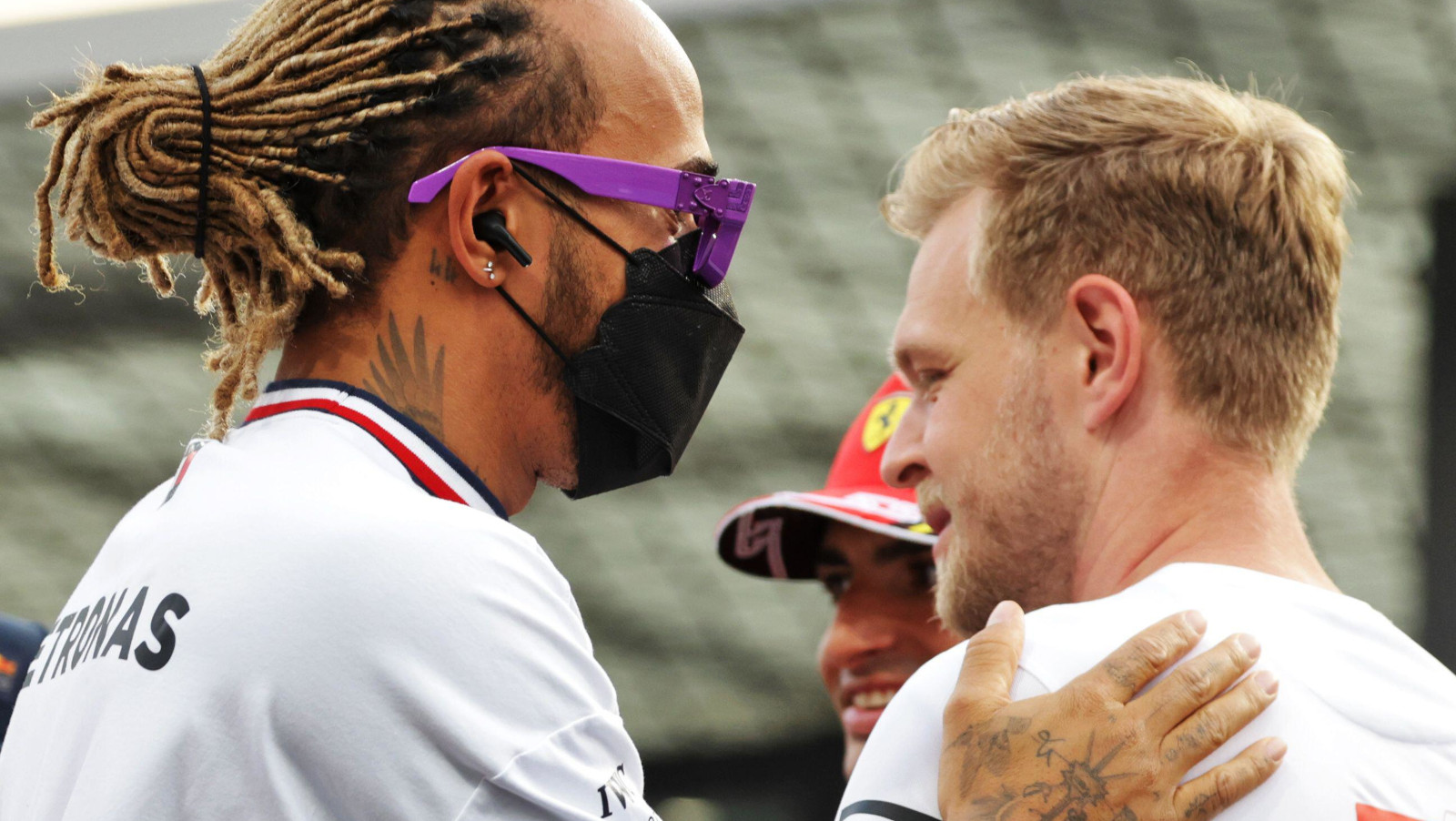 Lewis Hamilton pats Kevin Magnussen on the back. Jeddah March 2022