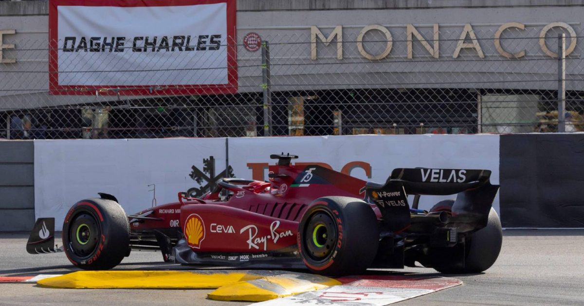Charles Leclerc drives past a banner dedicated to him. Monte Carlo May 2022.