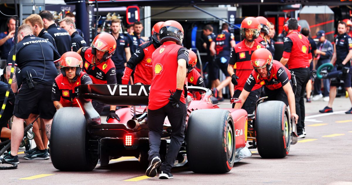 Charles Leclerc pushed down the pit lane by his Ferrari mechanics. Monaco May 2022