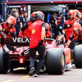 Charles Leclerc pushed down the pit lane by his Ferrari mechanics. Monaco May 2022