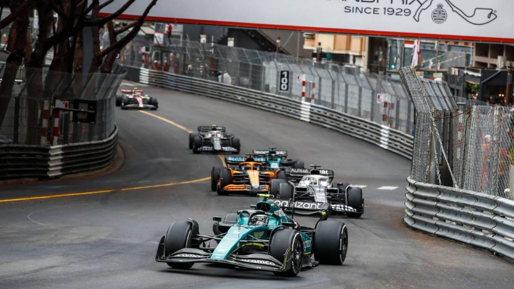 Sebastian Vettel heads a train of cars during the Monaco GP. Monte Carlo May 2022.